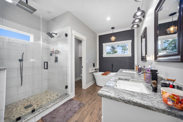 1065 Cc Rd, Diboll, TX 75941 - bathroom featuring double vanity, a shower stall, toilet, and plenty of natural light