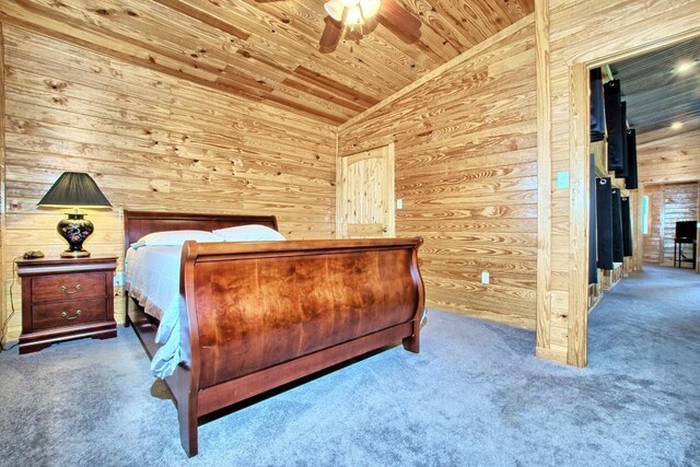 bedroom with carpet flooring, wooden ceiling, ceiling fan, and lofted ceiling