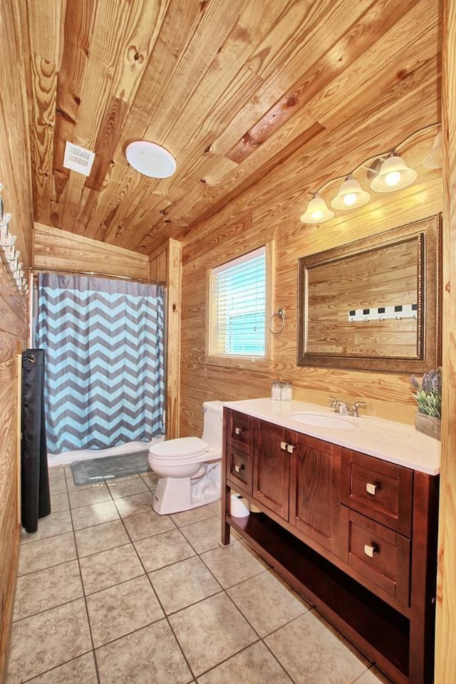 bathroom with vanity, wood walls, tile patterned flooring, toilet, and wood ceiling