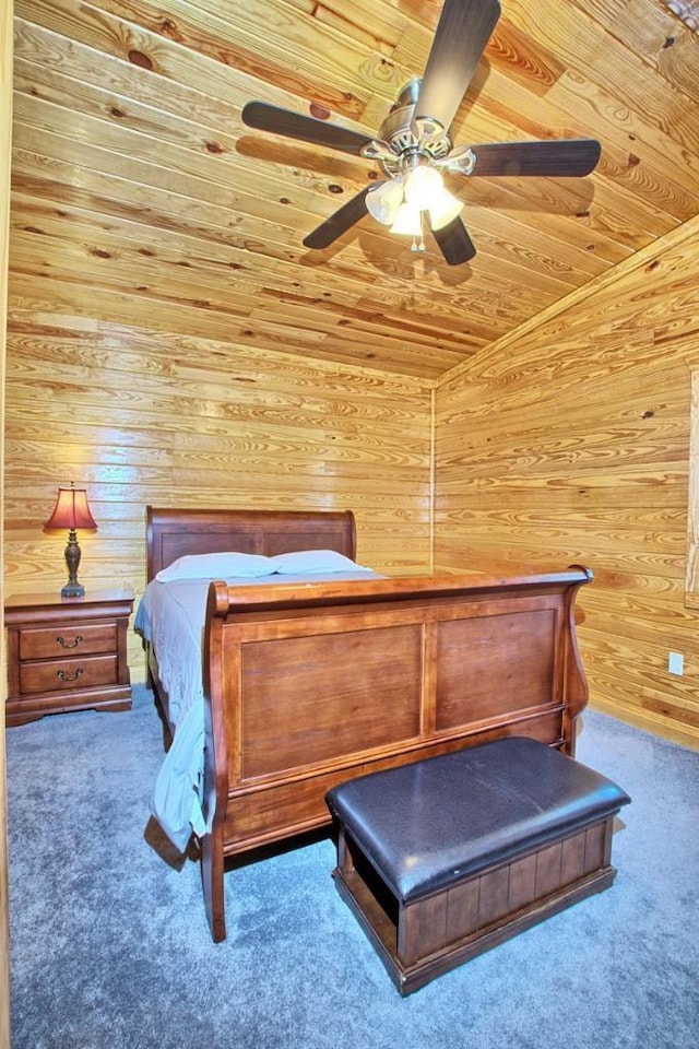 bedroom featuring carpet flooring, ceiling fan, wooden walls, wooden ceiling, and lofted ceiling