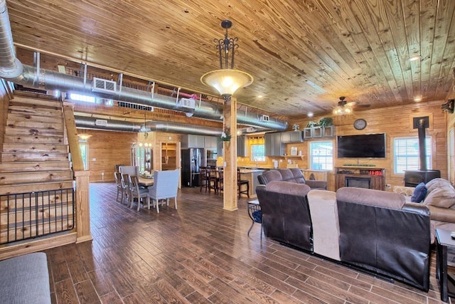 living room featuring wood walls, wooden ceiling, and hardwood / wood-style flooring