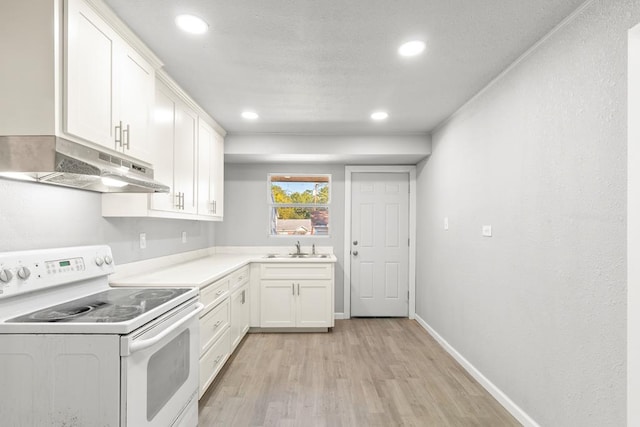 kitchen featuring sink, white cabinets, white electric range oven, and light hardwood / wood-style floors