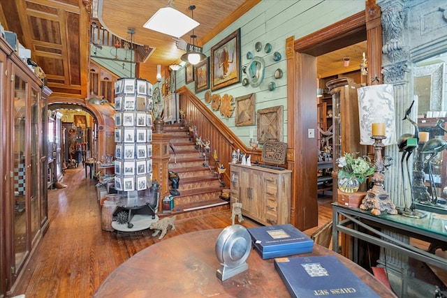 310 N Mound St, Nacogdoches, TX 75961 - stairway with wood walls, wood finished floors, and arched walkways