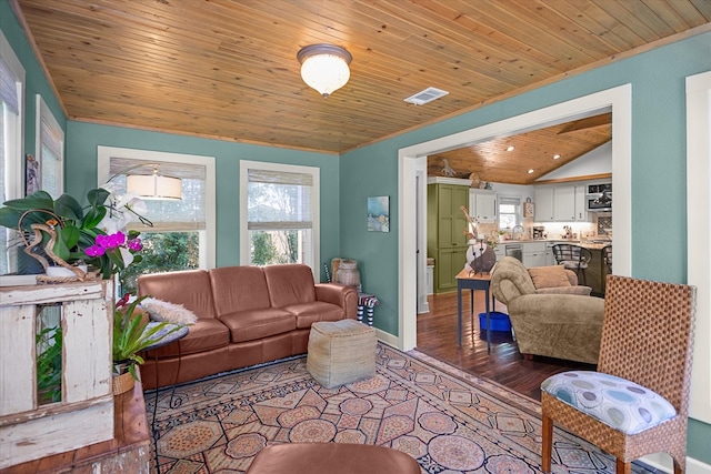 310 N Mound St, Nacogdoches, TX 75961 - living area with healthy amount of natural light, vaulted ceiling, wooden ceiling, baseboards, and wood finished floors