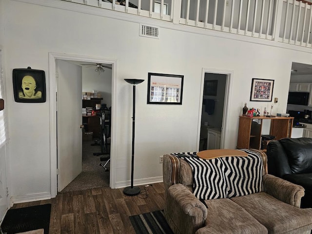 2540 Brentwood Dr, Lufkin, TX 75901 - living area with dark wood-style flooring, a towering ceiling, and a ceiling fan