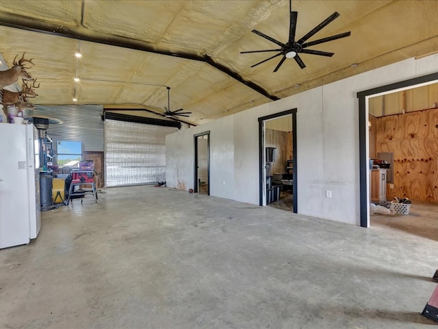interior space featuring ceiling fan and freestanding refrigerator