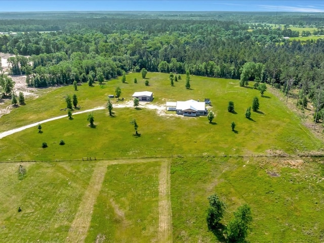 drone / aerial view featuring a rural view and a forest view