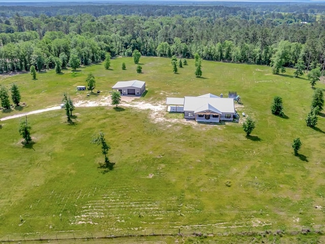 bird's eye view with a rural view and a wooded view