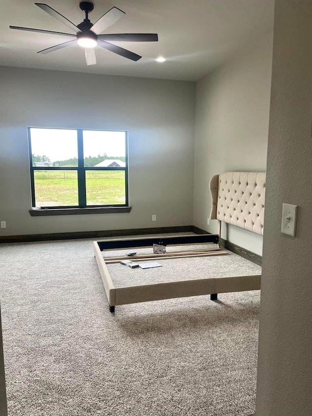 bedroom with carpet floors and a ceiling fan