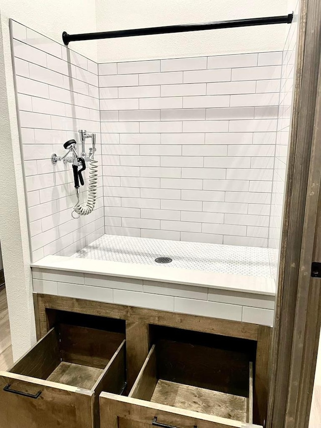 interior space featuring tiled shower