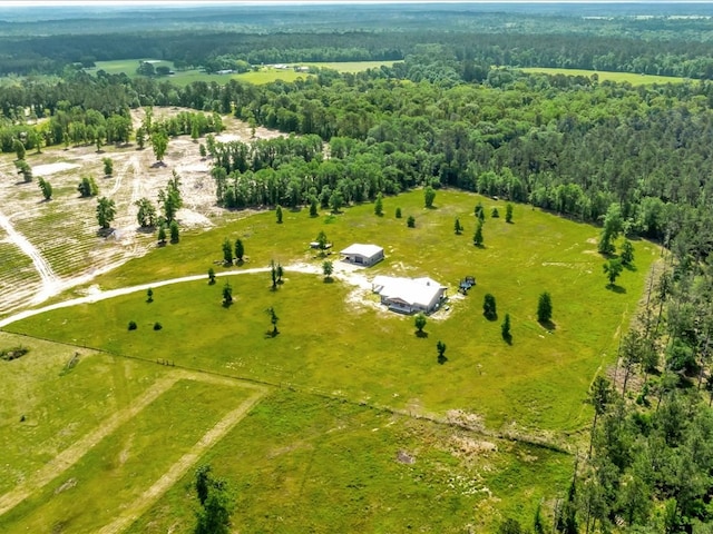 bird's eye view with a rural view and a view of trees
