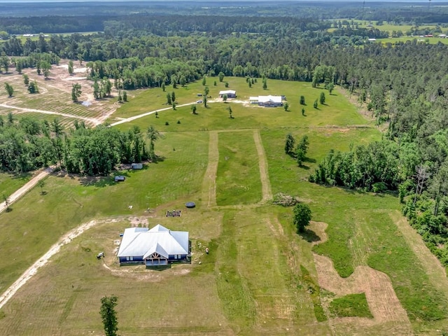 bird's eye view with a rural view and a forest view