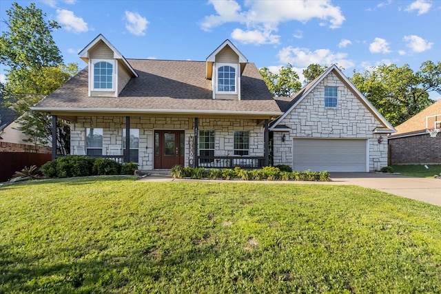 454 Bobwhite Dr, Lufkin, TX 74904 - view of front of home with stone siding, roof with shingles, covered porch, a front lawn, and concrete driveway