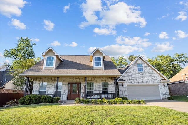 454 Bobwhite Dr, Lufkin, TX 74904 - view of front of home with stone siding, covered porch, a front lawn, and driveway