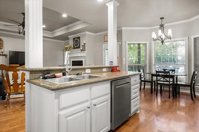 454 Bobwhite Dr, Lufkin, TX 74904 - kitchen with dishwasher, decorative columns, ornamental molding, a fireplace, and light wood-type flooring