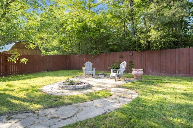 454 Bobwhite Dr, Lufkin, TX 74904 - fenced backyard with an outdoor fire pit and a patio