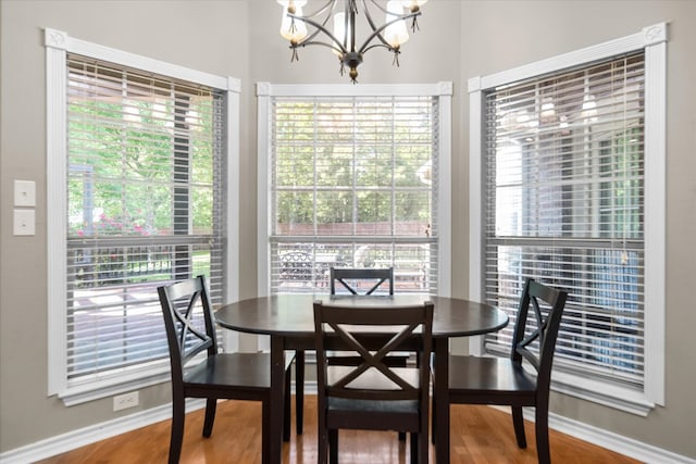 454 Bobwhite Dr, Lufkin, TX 74904 - dining area with a chandelier, wood finished floors, and plenty of natural light