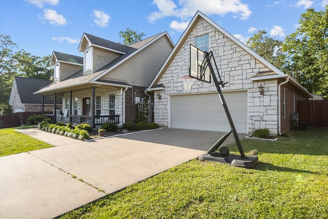 454 Bobwhite Dr, Lufkin, TX 74904 - view of front of house with stone siding, a porch, driveway, and a garage