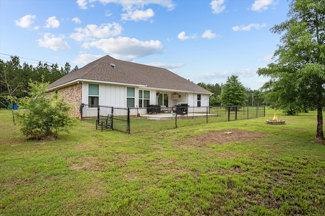 1755 Cc Rd, Diboll, TX 75941 - rear view of property with a fire pit, a fenced backyard, a patio, roof with shingles, and a gate
