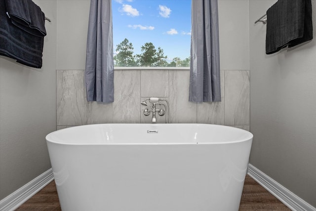 1755 Cc Rd, Diboll, TX 75941 - full bath with a freestanding tub and wood finished floors