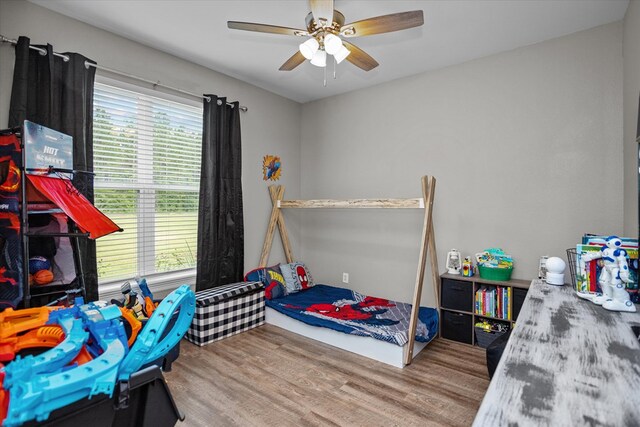 1755 Cc Rd, Diboll, TX 75941 - bedroom with wood finished floors and a ceiling fan