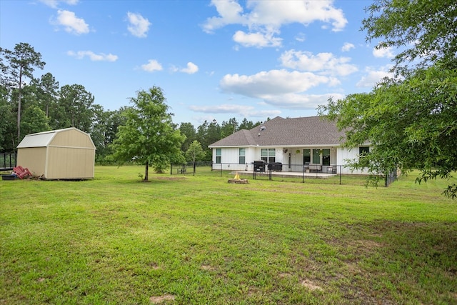 1755 Cc Rd, Diboll, TX 75941 - fenced backyard featuring a storage unit and a patio area