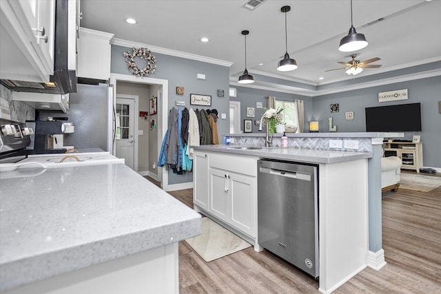 1755 Cc Rd, Diboll, TX 75941 - kitchen featuring dishwasher, crown molding, light wood finished floors, white cabinets, and decorative light fixtures