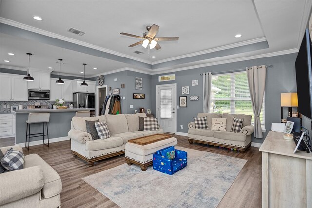 1755 Cc Rd, Diboll, TX 75941 - living area featuring a ceiling fan, dark wood finished floors, recessed lighting, and crown molding