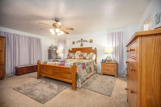 carpeted bedroom featuring a ceiling fan