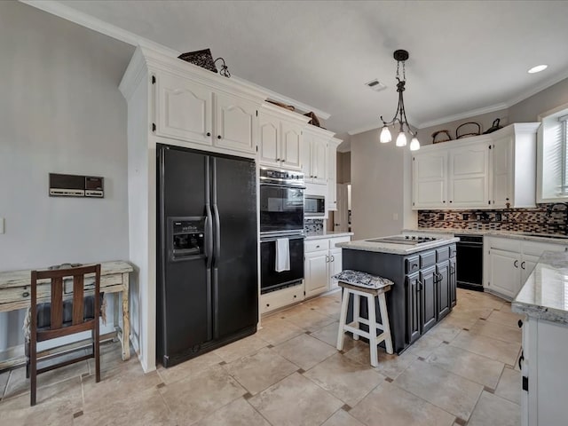 kitchen featuring decorative backsplash, crown molding, black appliances, decorative light fixtures, and a center island