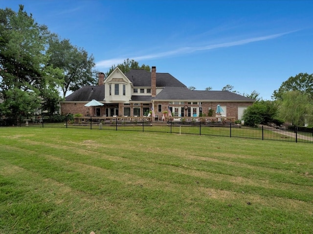 back of house with a yard