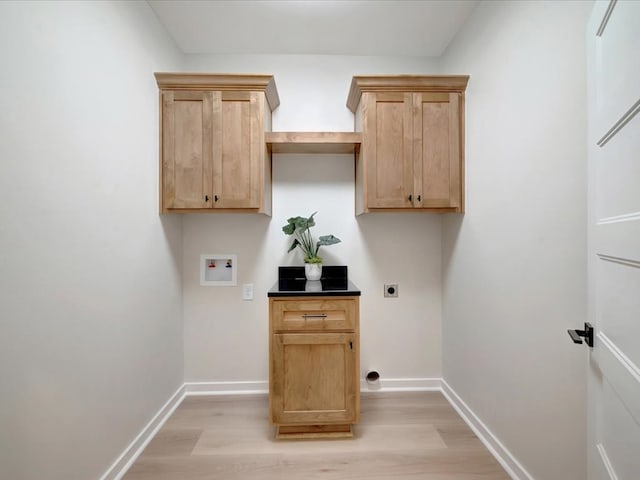 234 Lancewood Dr, Lufkin, TX 75904 - laundry room with electric dryer hookup, light wood finished floors, washer hookup, and cabinet space