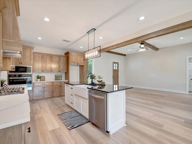 234 Lancewood Dr, Lufkin, TX 75904 - kitchen featuring stainless steel appliances, light wood-style flooring, tasteful backsplash, hanging light fixtures, and ceiling fan