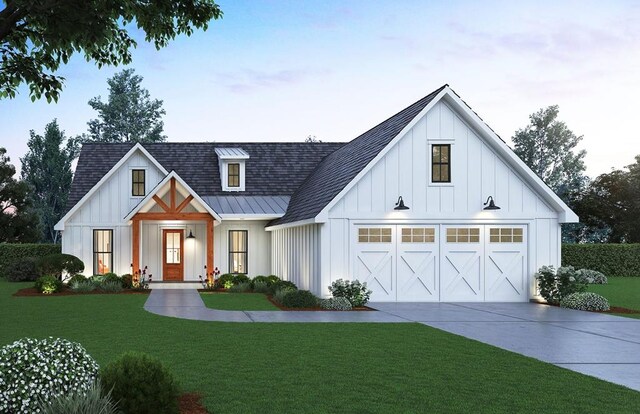 modern inspired farmhouse with a garage and a front yard