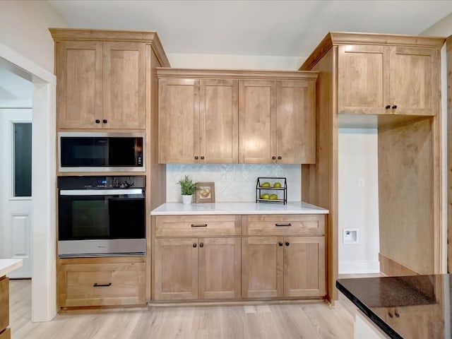 234 Lancewood Dr, Lufkin, TX 75904 - kitchen with stainless steel appliances, light wood-style floors, and decorative backsplash