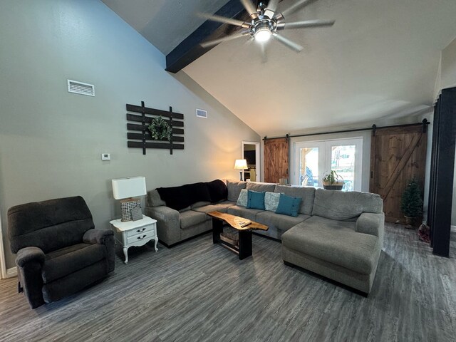 270 Lakeshore Dr, Brookeland, TX 75931 - living area with a barn door, a ceiling fan, wood finished floors, beam ceiling, and high vaulted ceiling