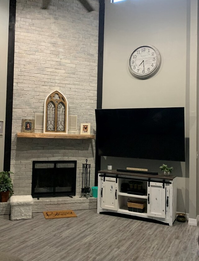 270 Lakeshore Dr, Brookeland, TX 75931 - living room with wood finished floors and a brick fireplace