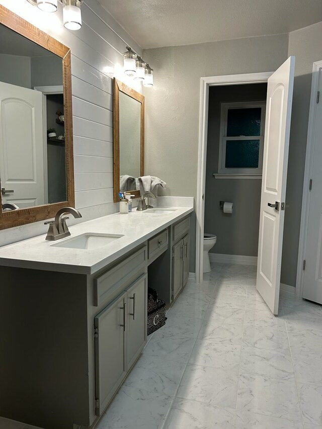 270 Lakeshore Dr, Brookeland, TX 75931 - bathroom featuring marble finish floors and double vanity
