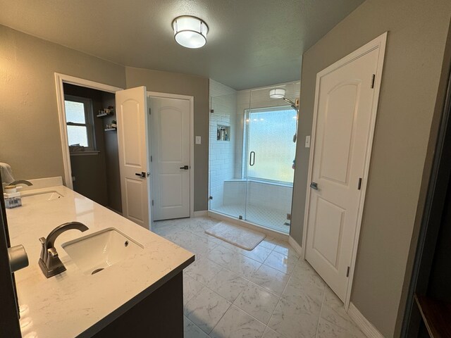 270 Lakeshore Dr, Brookeland, TX 75931 - full bathroom featuring marble finish floors, a shower stall, and double vanity