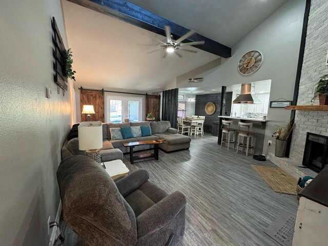 270 Lakeshore Dr, Brookeland, TX 75931 - kitchen featuring a barn door, wood finished floors, and wine cooler