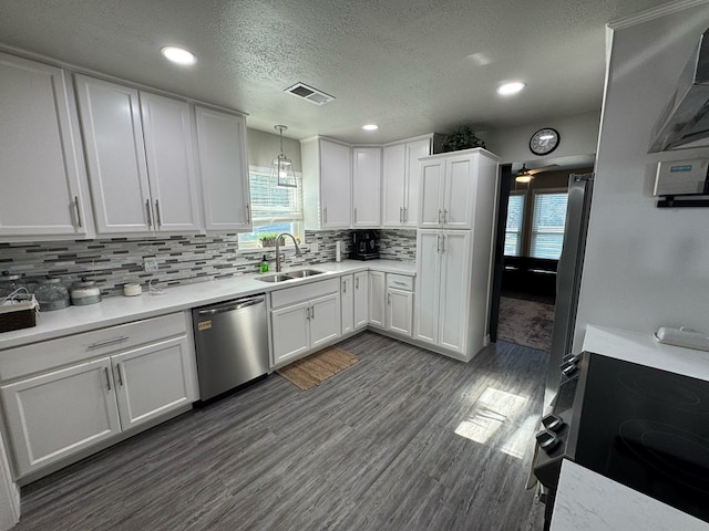 270 Lakeshore Dr, Brookeland, TX 75931 - kitchen with dishwasher, electric range, white cabinetry, light countertops, and recessed lighting