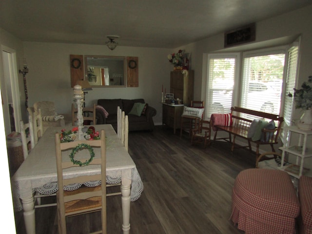 dining area with dark hardwood / wood-style flooring