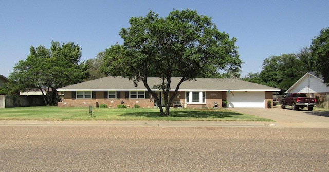 ranch-style house with a front lawn and a garage