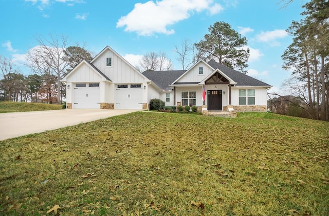 view of front of house with a garage and a front lawn