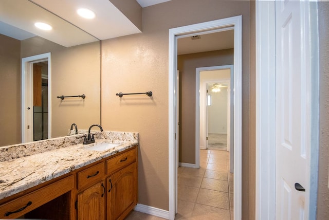 bathroom with tile patterned flooring and vanity