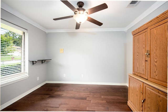 interior space featuring dark hardwood / wood-style floors, ceiling fan, and ornamental molding