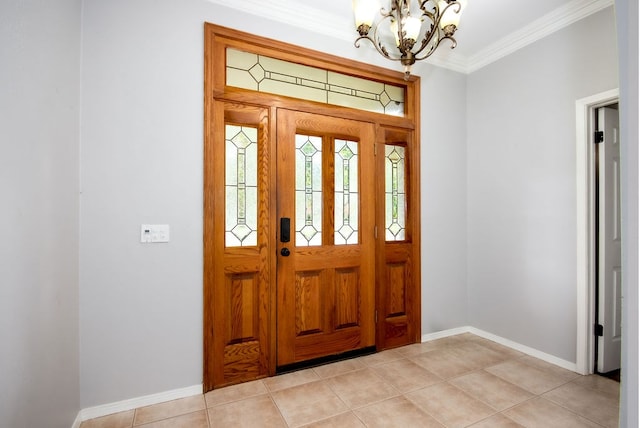 tiled entryway with an inviting chandelier and crown molding