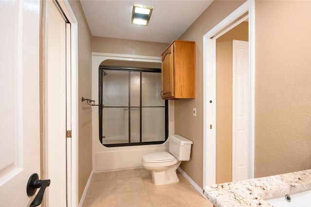 full bathroom with tile patterned flooring, vanity, enclosed tub / shower combo, and toilet