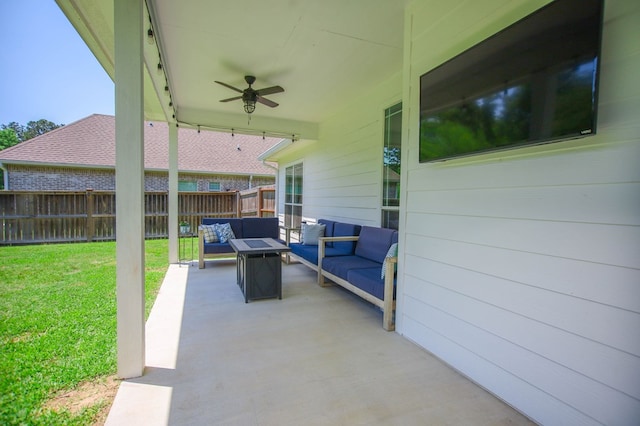 view of patio with a fenced backyard, an outdoor living space, and a ceiling fan