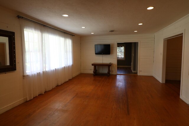 unfurnished living room featuring hardwood / wood-style floors